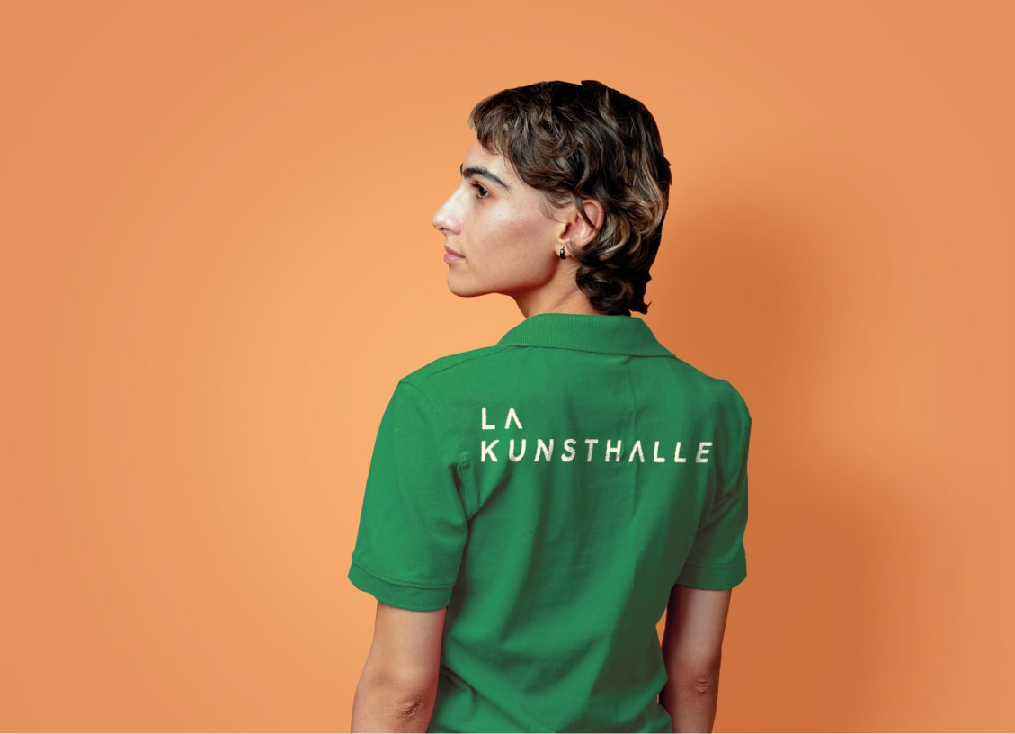 Green Kunsthalle T-shirt from the back worn by a woman